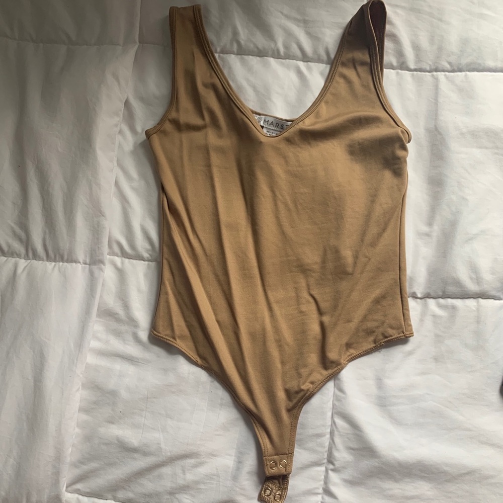 Beige/nude bodysuit. Deep v neck. Size 8-10. New